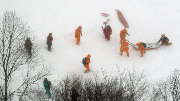 Firefighters make rescue operation at a ski resort following an avalanche in Nasu.