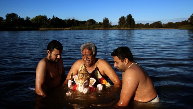 Members of  Hindu community celebrate a festival paying homage to the deity Ganesha at Liverpool in Sydney's south-west. 