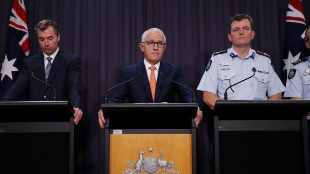 Prime Minister Malcolm Turnbull with Justice Minister Michael Keenan and AFP Commissioner Andrew Colvin on Tuesday.