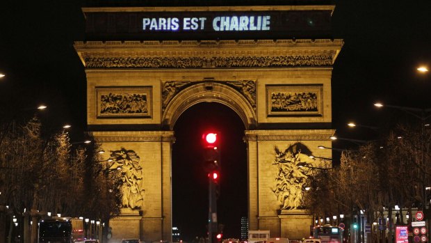 The message "Paris is Charlie" is projected on the Arc de Triomphe in Paris.
