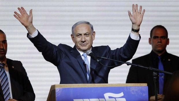 Israeli Prime Minister Benjamin Netanyahu waves to supporters in Tel Aviv after claiming victory at the polls.