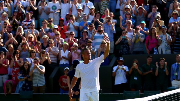 Fond farewell: Australia's Lleyton Hewitt waves goodbye to the Wimbledon crowd after losing to Jarkko Nieminen.