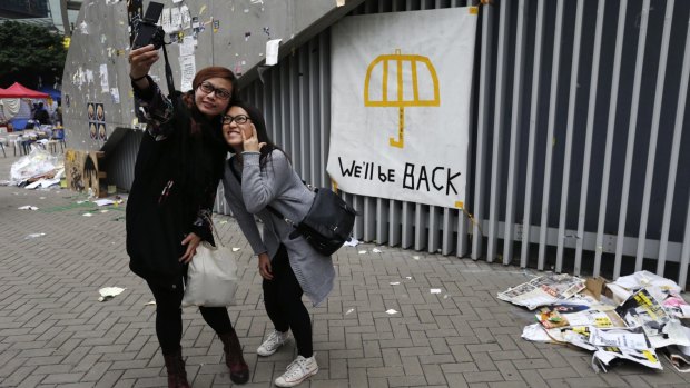 Protesters take a last selfie at the camp site in Hong Kong's Admiralty district on Thursday.