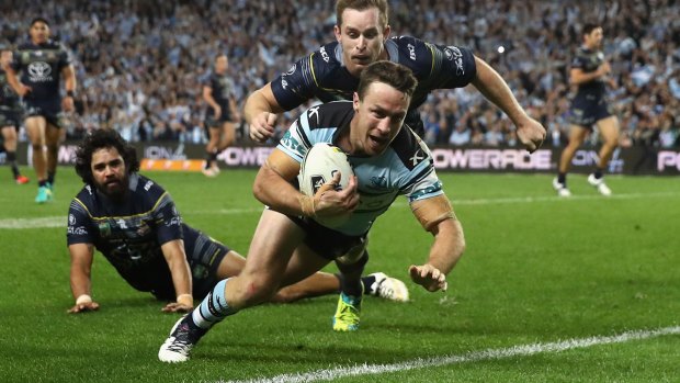 And they're through: James Maloney scores as the Sharks dispatch the Cowboys in the preliminary final.