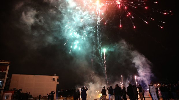 Supporters of Turkey's President Recep Tayyip Erdogan and The Justice and Development Party, (AKP), let off fireworks in Istanbul on Sunday. 