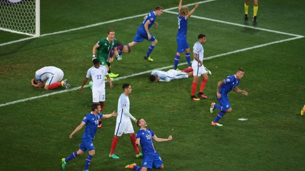 A picture paints a thousand words: Players from both sides react after the final whistle.