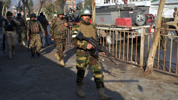 Afghan National Army soldiers take their positions at the clash site near Pakistan's consulate in Jalalabad, Afghanistan.