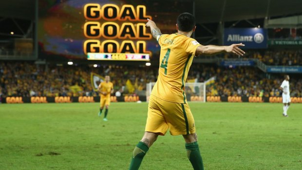 Sign says it all: Tim Cahill celebrates scoring another goal for the Socceroos.