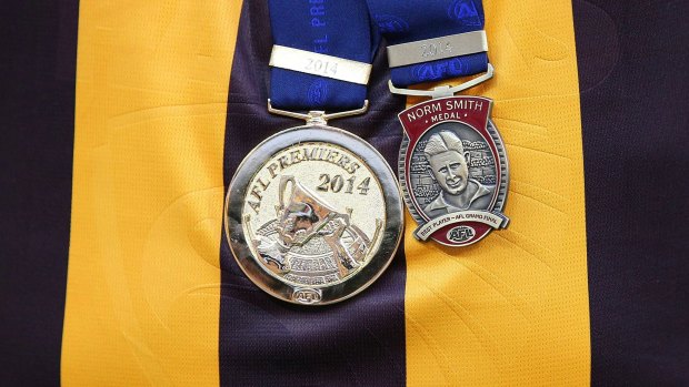 The Norm Smith medal won by Luke Hodge, with his premiership medallion.