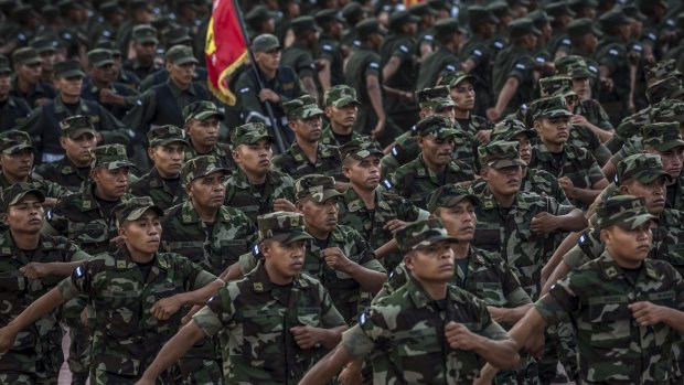 Soldiers march at an event to celebrate the 36th anniversary of the constitution of the country's air force in Managua.