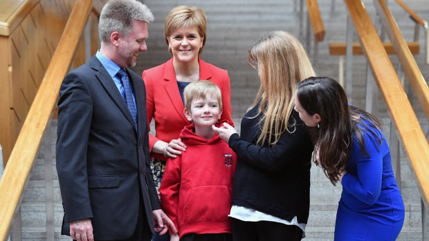 Gregg, Kathryn and Lachlan Brain meet Scotland's First Minister Nicola Sturgeon, second from left, and MP Kate Forbes, right, at the Scottish Parliament in May.