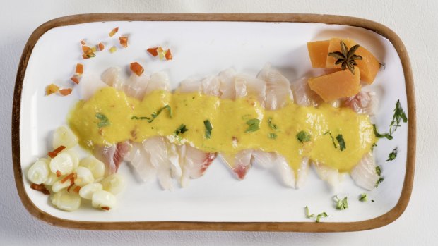 Tiradito is raw fish cut thin and long like sashimi and covered in a rich sauce.