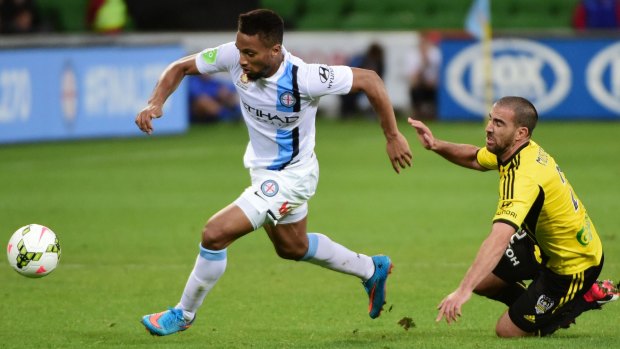 Harry Novillo of Melbourne City gets away from Manny Muscat of Wellington Phoenix during the A-League match on Sunday.