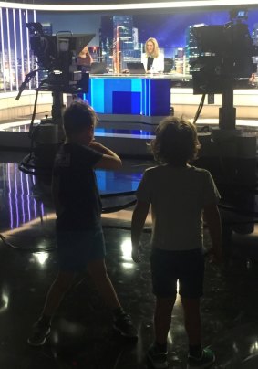 Jacinta's kids watch on as she delivers the news. 