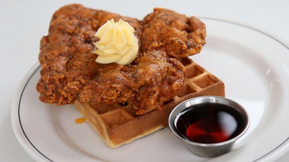 Fried chicken and waffle with whipped butter and bourbon-spiked maple syrup.