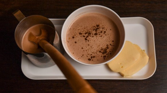 Pour the hot chocolate over the mozzarella then froth with the paddle.