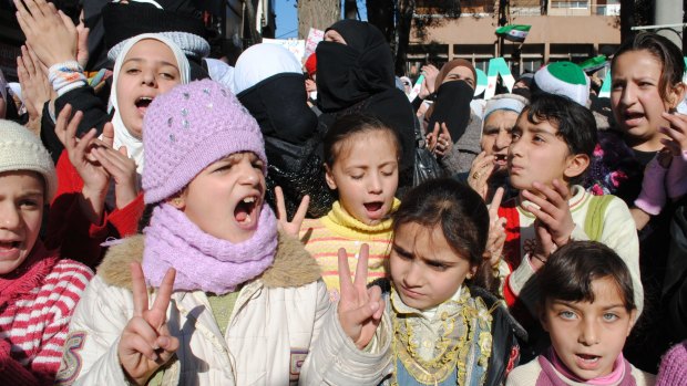 Children chant slogans during an anti-Syrian regime demonstration at the mountain resort town of Zabadani, Syria, near the Lebanese border, in 2012.