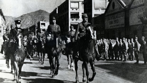 Lieutenant-General Takashi Sakai (right) on horseback  after the Battle of Hong Kong on December 28, 1941 in Hong Kong.
