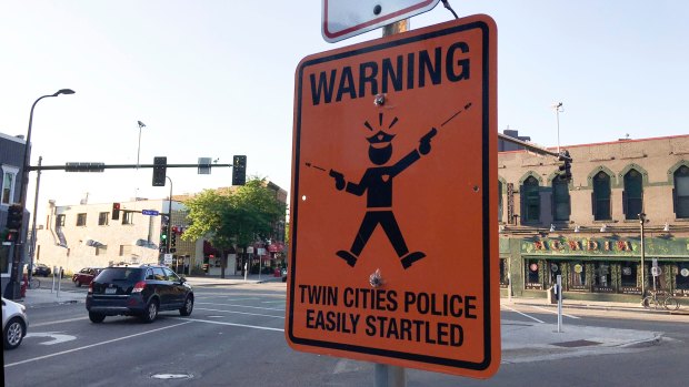 A fake street sign in Minneapolis warns of  "easily startled" police officers. 