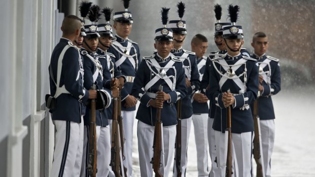 Soldiers wait for the start of a military ceremony recognising Guatemala's new Acting President Alejandro Maldonado as commander-in-chief on Friday.