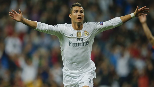 Hat trick and record: Real Madrid's Cristiano Ronaldo celebrates his triple against Shakhtar Donetsk in Madrid.