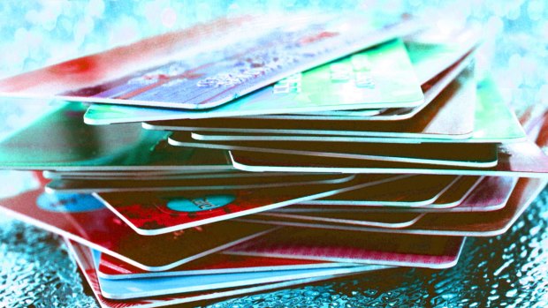 Stacked: Collectively we owe $50.1 billion on credit and charge cards – and pay 0.52 per cent too much for it.