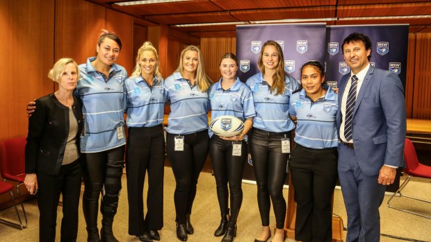 Revolution: NSWRL board member Deborah Healey, members of NSW’s victorious women’s Interstate Challenge side, and NSW Blues coach Laurie Daley.
 