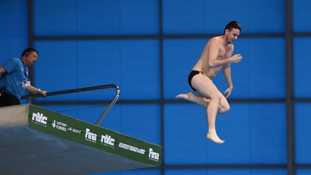 An intruder jumps into the pool during the Men's 10m Final during the FINA/NVC Diving World Series at the Aquatics Centre in London.
