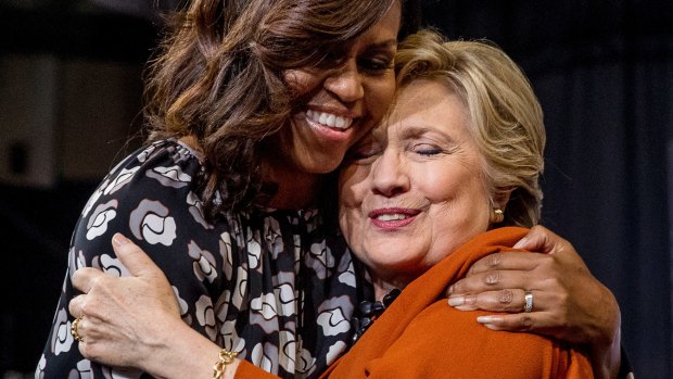 A hug after speaking: first lady Michelle Obama and Democratic presidential candidate Hillary Clinton on stage together.