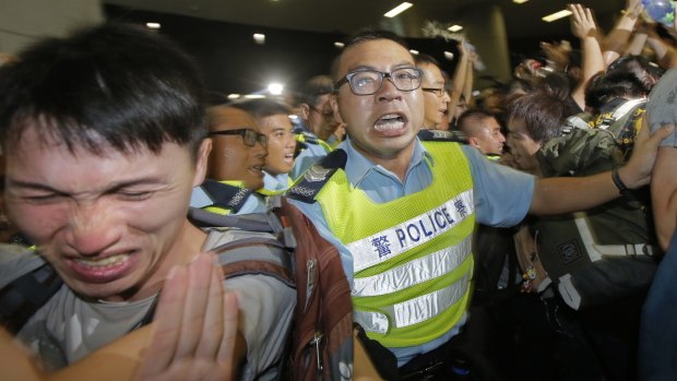 Pepper power:A protester reacts after police  used pepper spray against a bid to break into the Legislative building in Hong Kong. 