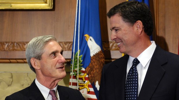 Then-incoming FBI Director James Comey with his outgoing director Robert Mueller before Comey in April 2013.