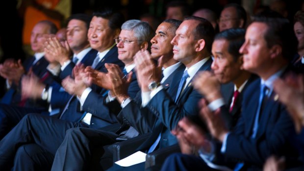 The G20 line-up applauds.