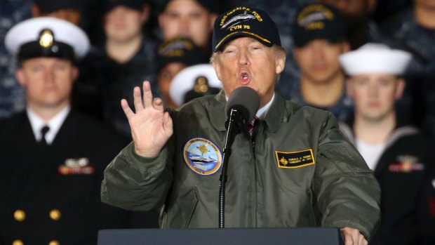 Splashy commander-in-chief moment: Sporting a bomber jacket and navy cap, Donald Trump rallies sailors and shipbuilders in Newport News.