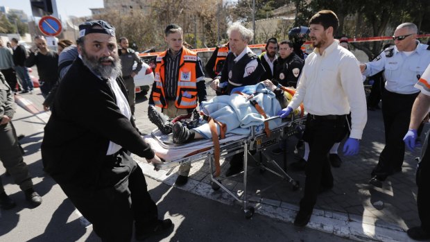 Israeli medics evacuate an injured person from the scene of the attack.