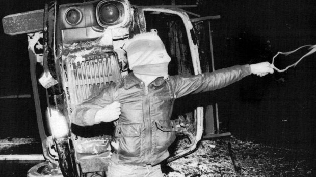 A rioter uses a slingshot against British soldiers in the Falls Road area of Belfast after the death of Bobby Sands.