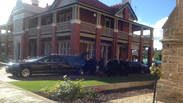 Alan Bond's casket arrives at his funeral at St Patrick's Basilica in Fremantle