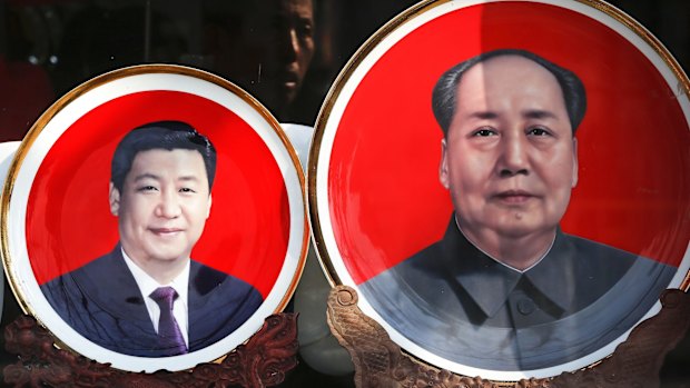 Souvenir plates bearing images of Chinese President Xi Jinping, left, and Mao Zedong  at a shop near Tiananmen Square in Beijing.  