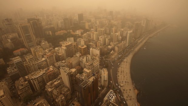 An unseasonal sandstorm shrouds Beirut, Lebanon, on Tuesday.