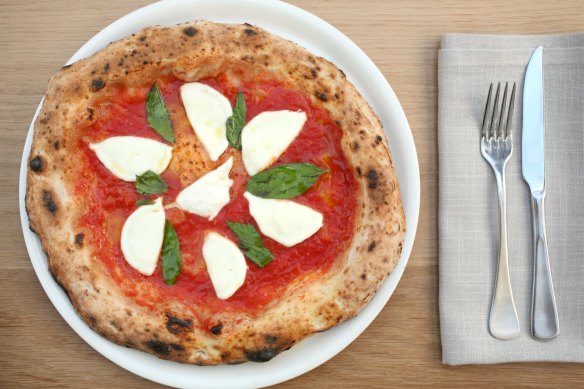 Go-to dish: Buffalo mozzarella pizza with fresh basil and San Marzano tomatoes.