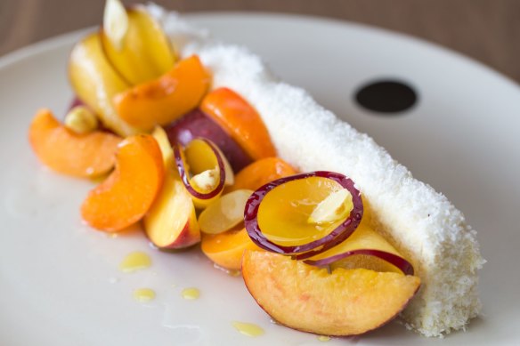 Josh Niland's vanilla coconut cake with stone fruit and green almonds.