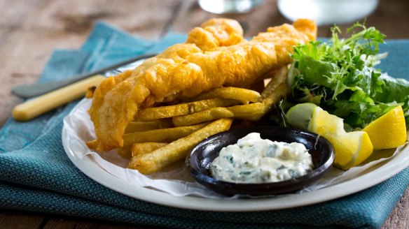 Serve your British fish and chips in newspaper and with a side of mushy peas. (