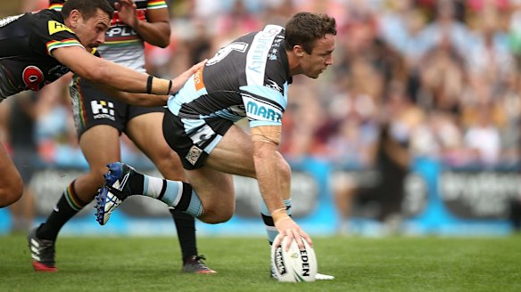Pivotal: James Maloney crosses the stripe for the Sharks.