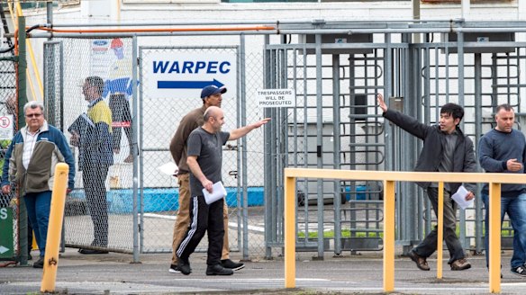 Former Ford workers leaving the Broadmeadows plant at the end of their last shift