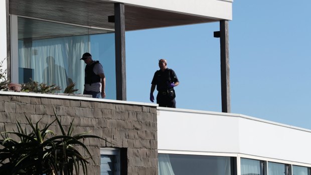 Police search John Ibrahim's clifftop home in Dover Heights.