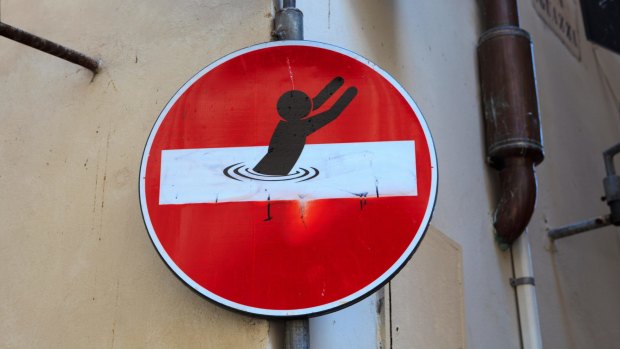 A road sign altered by street artist Clet Abraham.