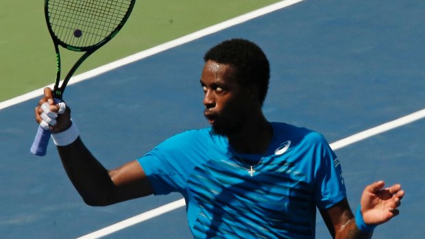 Gael Monfils waves to fans after winning his match.