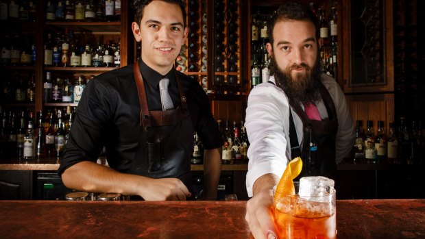 Molly bartenders Alex Gondzioulis and Zac Guertin mix an Old Fashioned.