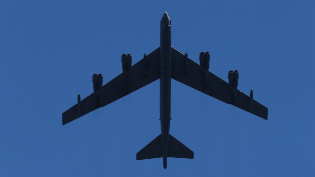 B52 fly past at the national ceremony for the 50th anniversary of the Battle of Long Tan in Canberra on Thursday.