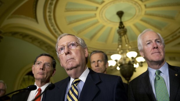 Majority Leader Mitch McConnell, second from left, accompanied by, from left, Senator John Barrasso, Senator John Thune, and Senate Majority Whip John Cornyn.