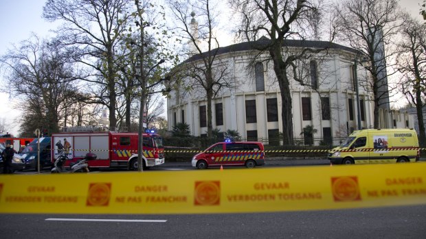 Police and fire personnel outside the Grand Mosque of Brussels on Thursday after a suspicious package was found there.